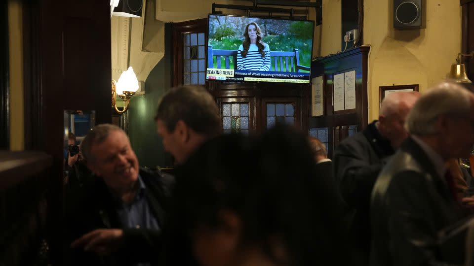 Kate's announcement of her cancer is broadcast as people watch at a pub in London, March 22, 2024. - Aaron Chown/Press Association/AP