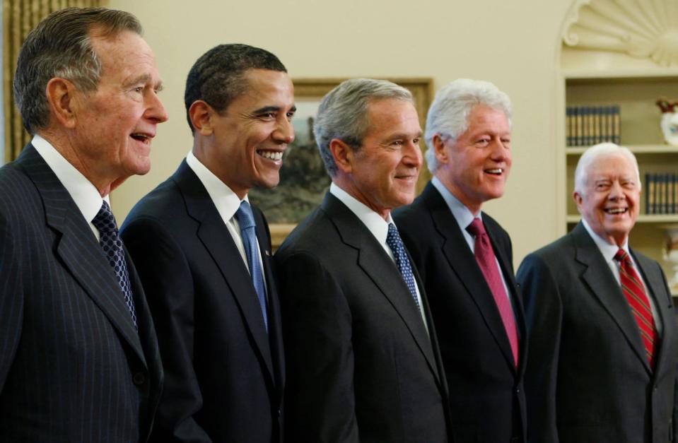 George H.W. Bush, Barack Obama, George W. Bush, Bill Clinton and Jimmy Carter are seen in this Associated Press file photo.