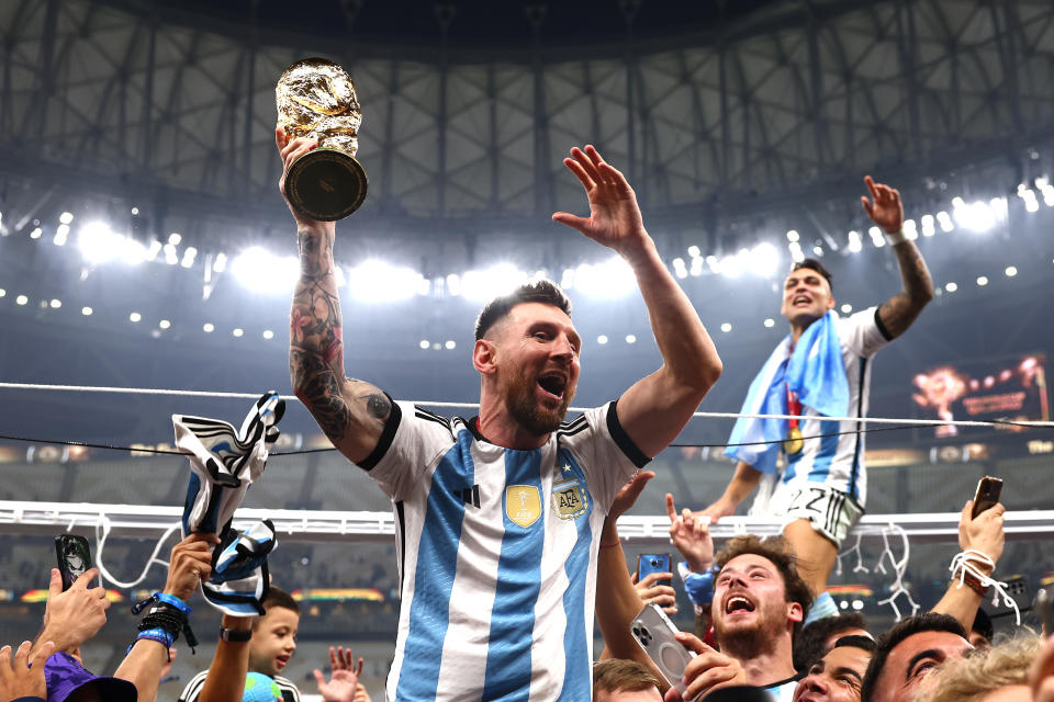 Lionel Messi of Argentina celebrates with the FIFA World Cup trophy following the FIFA World Cup Qatar 2022 