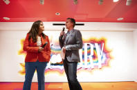 Rachel Shechtman, left, founder of Story, and Macy's CEO Jeff Gennette give a presentation on Story's opening day at Macy's, Wednesday, April 10, 2019, in New York. A year after buying startup Story, Macy's is bringing to life the retail concept shop to 36 stores in 15 states. (AP Photo/Mark Lennihan)