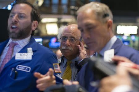 Traders work on the floor of the New York Stock Exchange April 20, 2015. REUTERS/Brendan McDermid