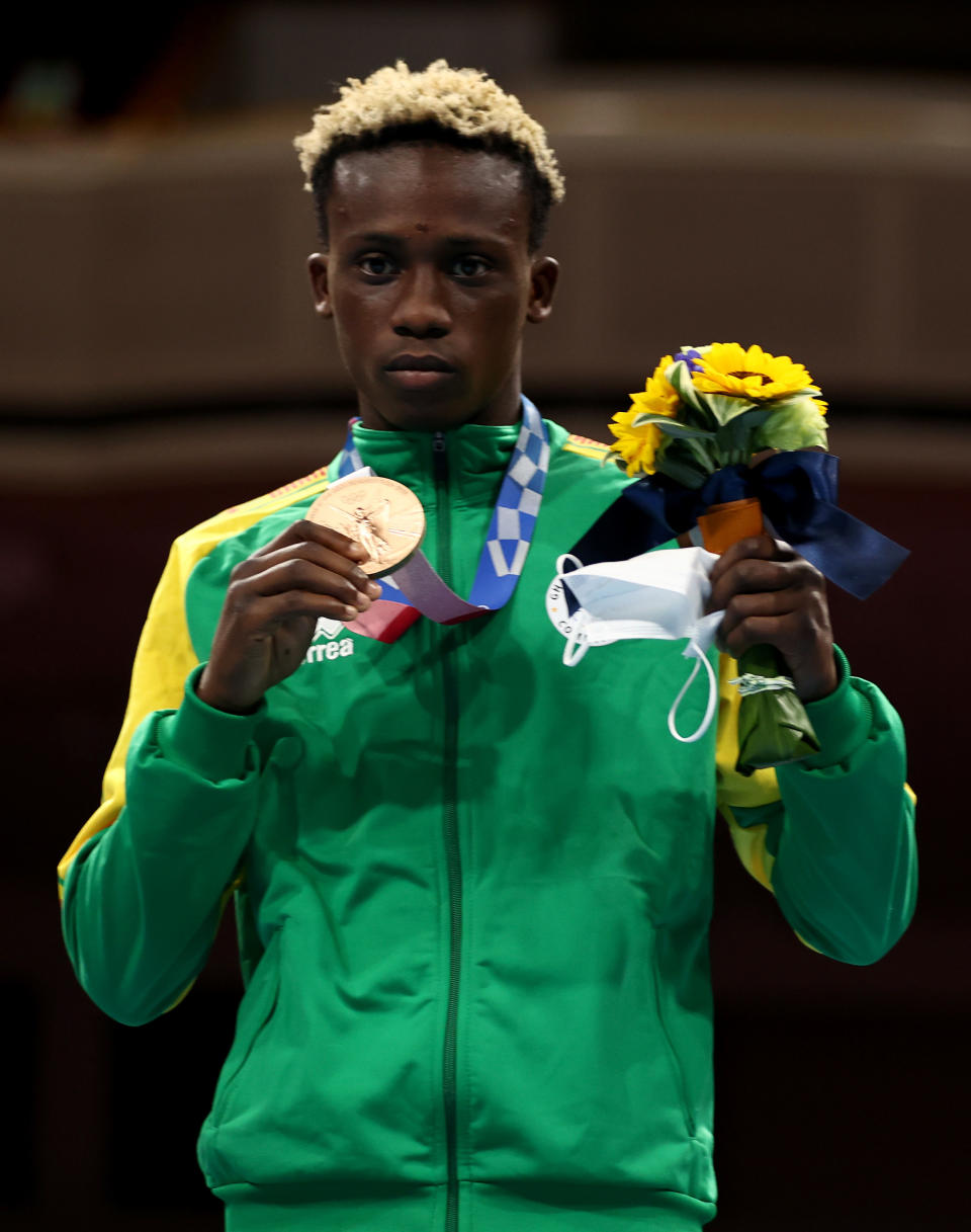 Samuel Takyi poses with bronze medal