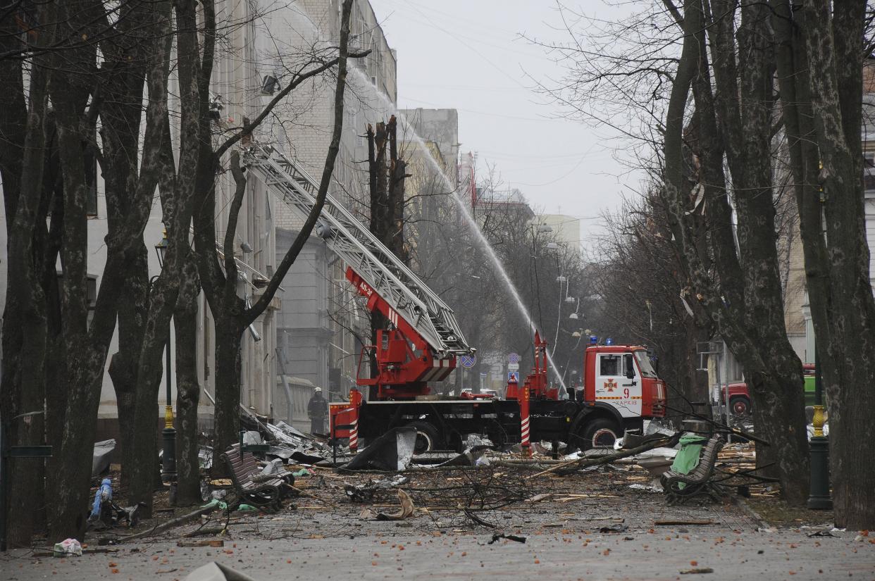 Firefighters extinguish a building of Ukrainian Security Service (SBU) after a rocket attack in Kharkiv, Ukraine's second-largest city, Ukraine, Wednesday, March 2, 2022.