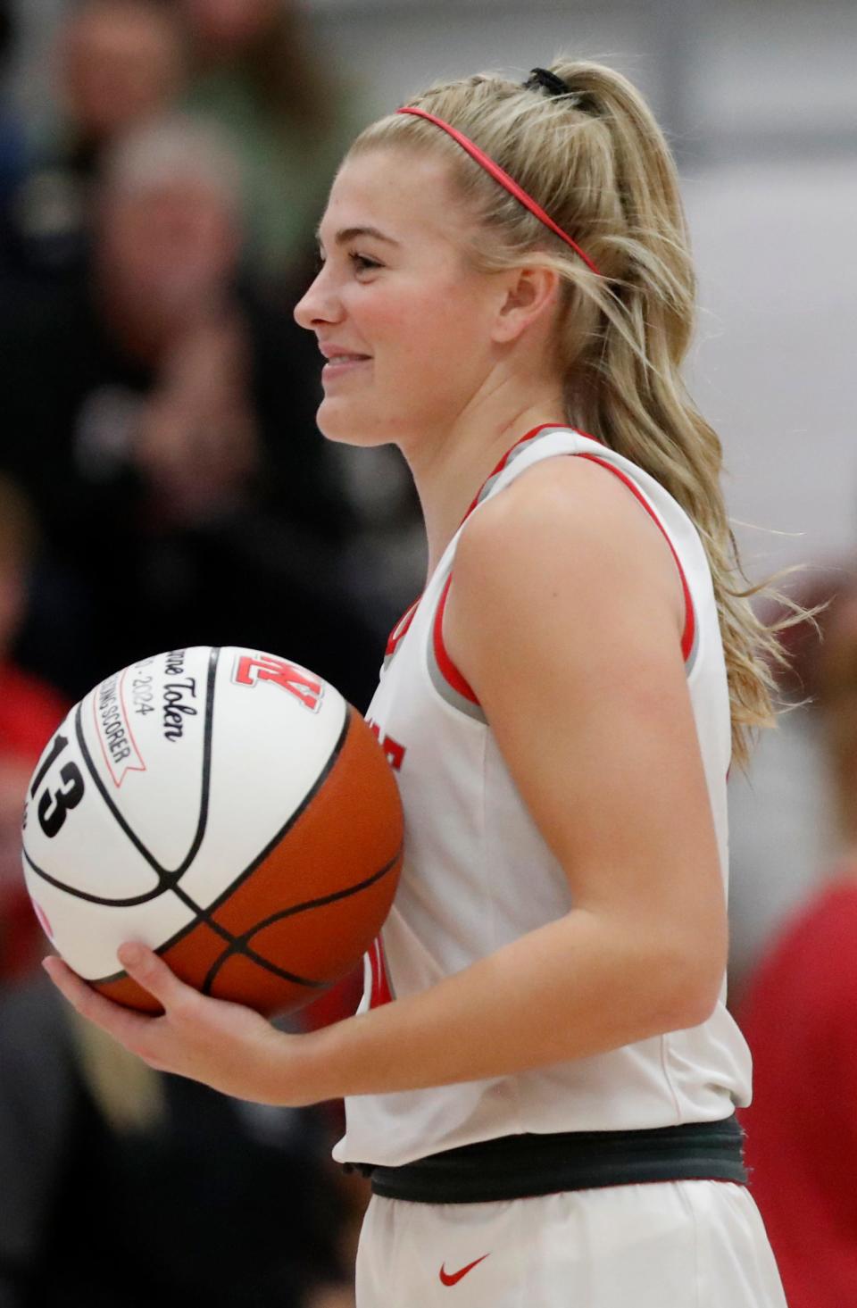 West Lafayette Red Devils Adrianne Tolen (10) is honored with a commemorative ball during the IHSAA basketball doubleheader against the Rensselaer Central Bombers, Thursday, Jan. 11, 2024, at West Lafayette High School in West Lafayette, Ind.