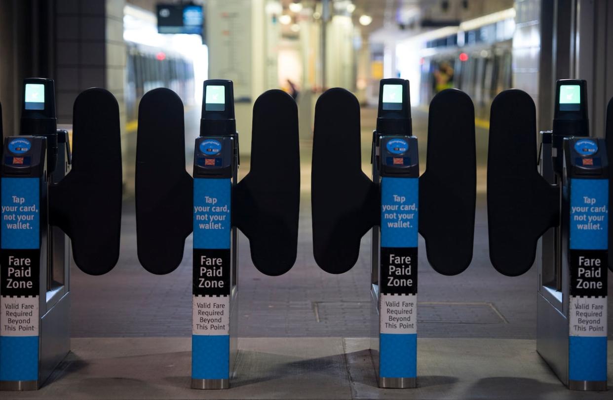 SkyTrain fare gates are pictured in downtown Vancouver on April 20, 2020. (Jonathan Hayward/The Canadian Press - image credit)