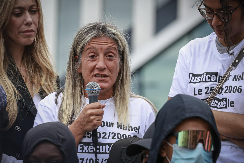 Mounia, mother of 17-year-old Nahel Merzouk who was killed by police, speaks at a silent protest to mark one year since his death, in Nanterre, west of Paris, Saturday, June 29, 2024. The murder of 17-year-old Nahel by an on-duty police officer in June 2023 sparked riots across France. (AP Photo/Aurelien Morissard)