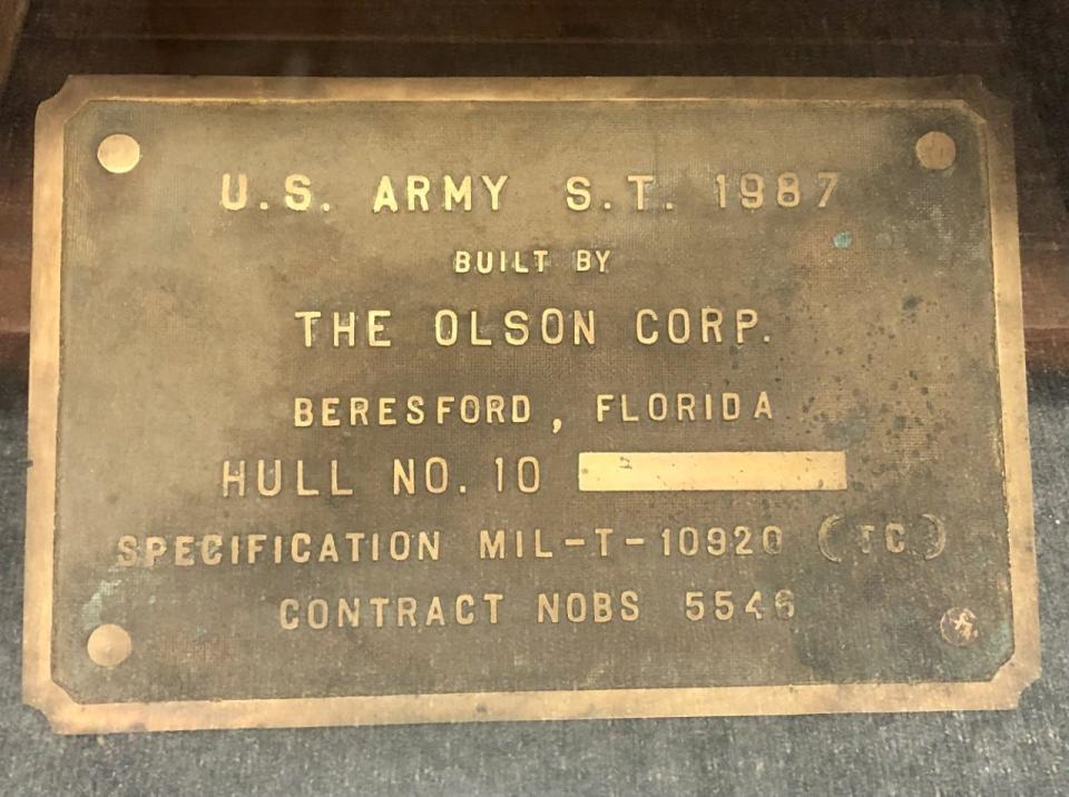 A 1940s-era plaque is featured in the DeLand Memorial Museum at Bill Dreggors Park. It was discovered in a local antique shop and is believed to have been taken from one of the tugboats built for World War II in about 1943 by The Olson Corp., on Lake Beresford in DeLand.