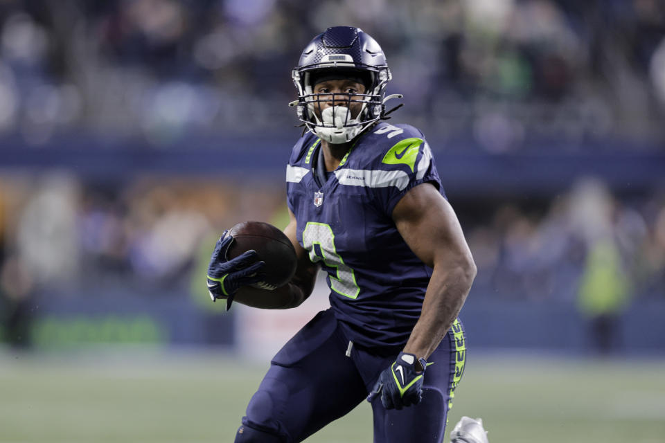 Seattle Seahawks running back Kenneth Walker III runs for a touchdown against the Philadelphia Eagles during the second half of an NFL football game, Monday, Dec. 18, 2023, in Seattle. (AP Photo/John Froschauer)