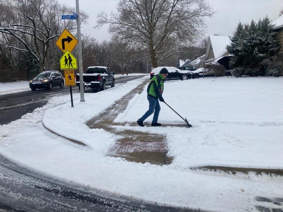 Jim Elmer of Levittown shovels his sidewalk on Holly Drive on Tuesday Jan. 16, 2024. About three inches of snow fell on Lower Bucks County, followed by drizzling rain, making it wet and heavy.