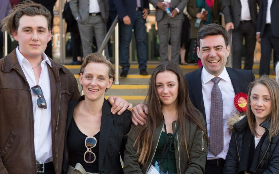 Family man: Andy Burnham with wife Marie-France van Heel and children (L to R) Jimmy, Rosie and Annie - AFP PHOTO / OLI SCARFFOLI SCARFF/AFP/Getty Images