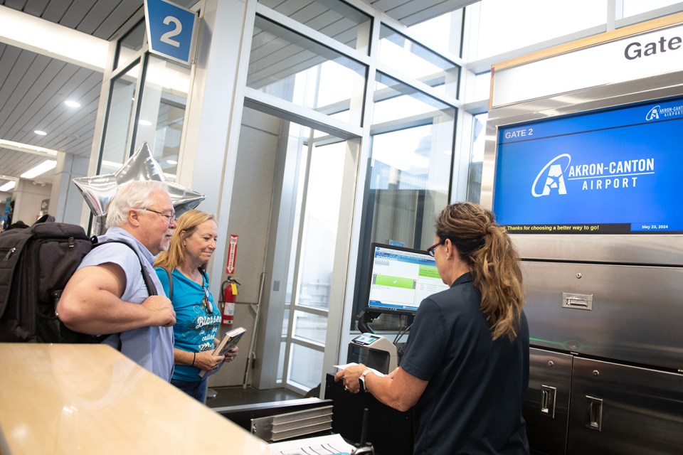 Bill and Margie Bishop, of Fairlawn, board the 9:15 Breeze Airways direct flight to Los Angeles from the Akron-Canton Airport in North Canton on Thursday, May 23.