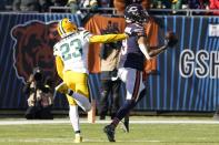 Chicago Bears' Equanimeous St. Brown catches a long pass in front of Green Bay Packers' Jaire Alexander during the first half of an NFL football game Sunday, Dec. 4, 2022, in Chicago. (AP Photo/Charles Rex Arbogast)