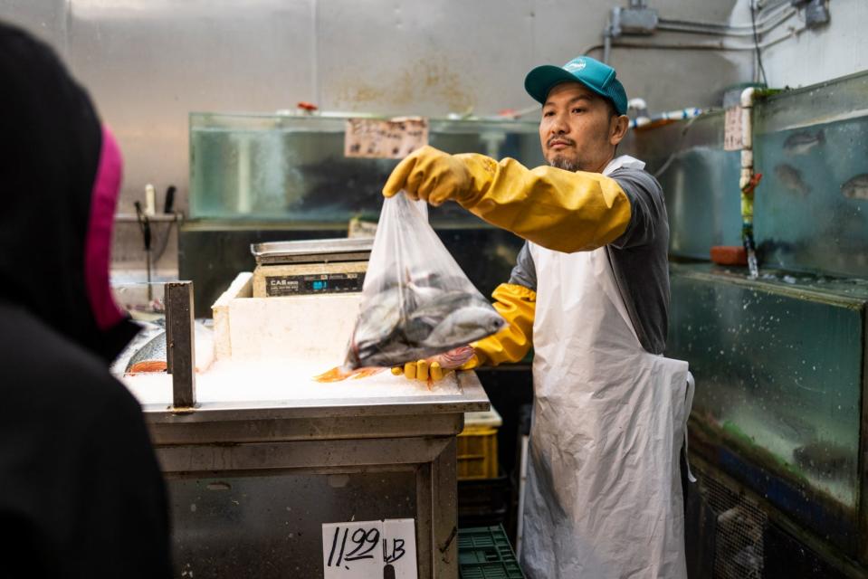 Eric Huynh and Finnie Phung, owners of The Green Fish Seafood Market in Oakland, California, on Thursday, Sept. 29, 2022.