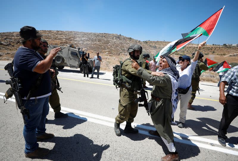 Palestinians protest against Israeli settlement activity in Al Mughayyir village