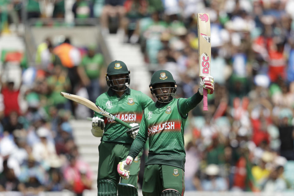 Bangladesh's Mushfiqur Rahim, right, celebrates reaching 50 runs next to Bangladesh's Shakib Al Hasan during the Cricket World Cup match between South Africa and Bangladesh at the Oval in London, Sunday, June 2, 2019. (AP Photo/Matt Dunham)