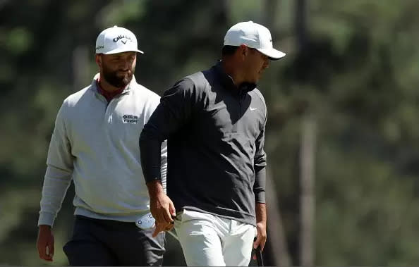 Jon Rahm and Brooks Koepka on from the 3rd green during the final round of the 2023 Masters Tournament at Augusta National on Apr 09, 2023 in Augusta, GA. (Photo by Patrick Smith via Getty Images)