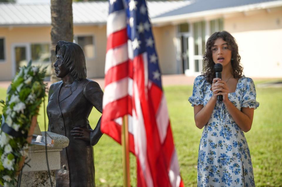 Arrianne Reif, a Lincoln Park Academy student, sings the national anthem at the Liberty Garden on Sept. 11, 2022, in a service remembering victims of the 9/11 attacks.