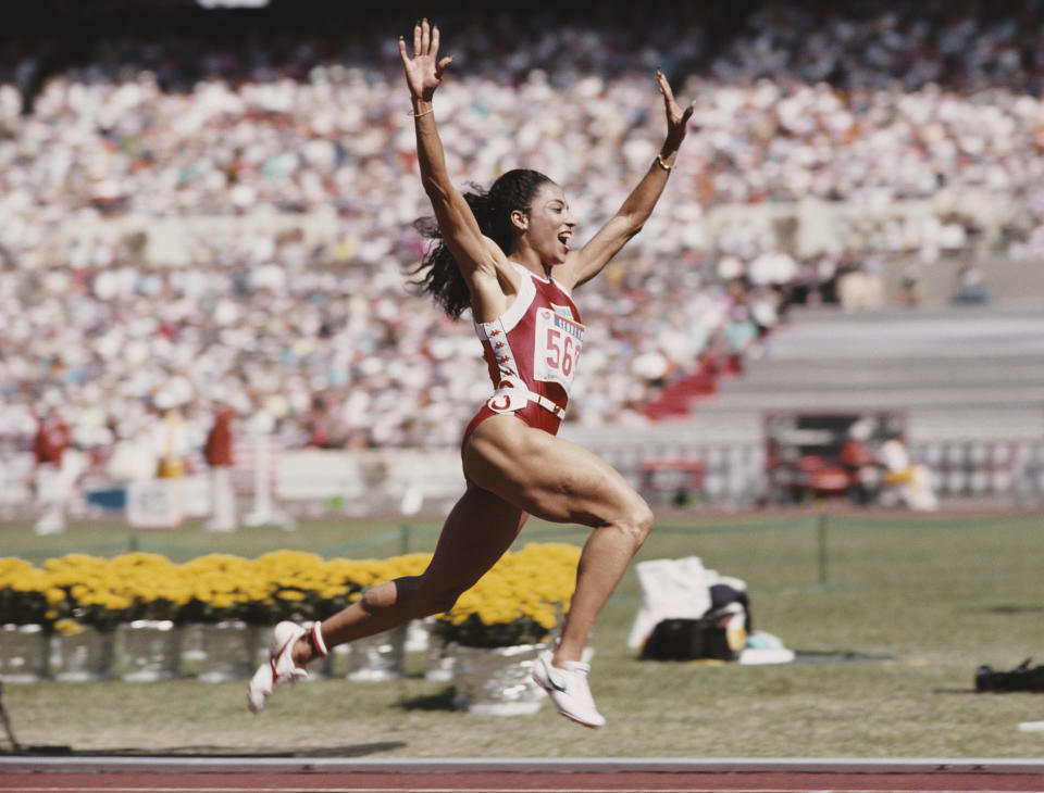 Florence Griffith-Joyner of the United States celebrates winning gold in the Women’s 100 metres final event during the XXIV Summer Olympic Games on 25 September 1988 at the Seoul Olympic Stadium in Seoul, South Korea.