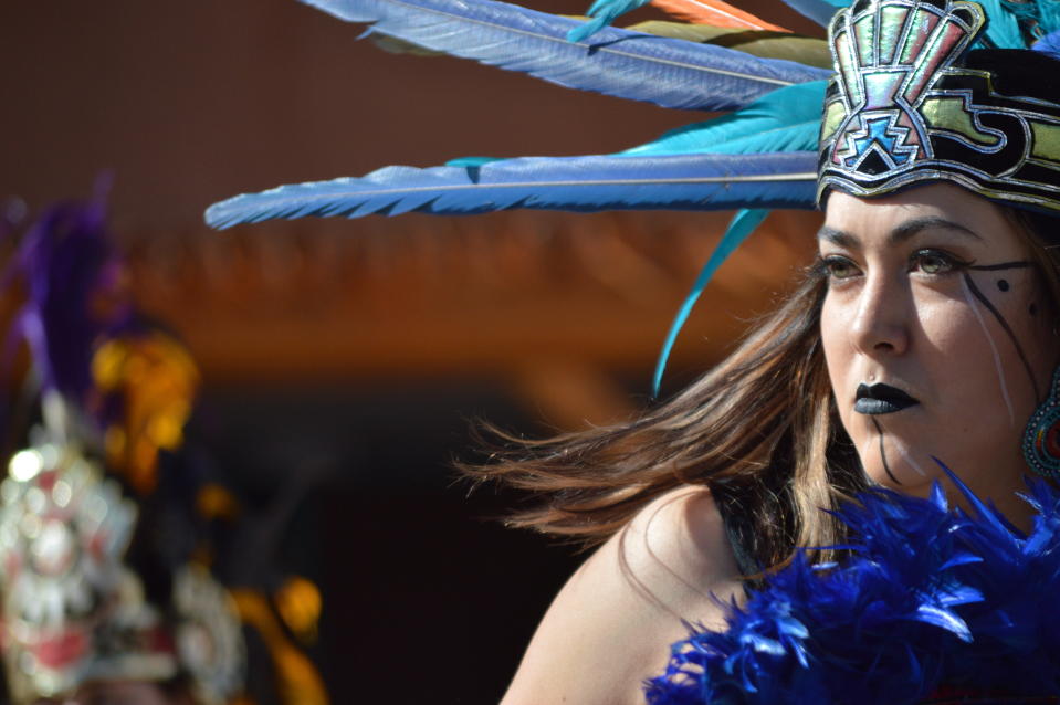 Crystal Zamora, 27, of Albuquerque, N.M., performs with the Ehecatl Aztec Dancers on Monday, Oct. 14, 2019, at the Indian Pueblo Cultural Center in Albuquerque, N.M. as part of New Mexico's first Indigenous Peoples Day. A handful of states celebrated their first Indigenous Peoples Day on Monday as part of a trend to move away from a day honoring Christopher Columbus. (AP Photo/Russell Contreras)