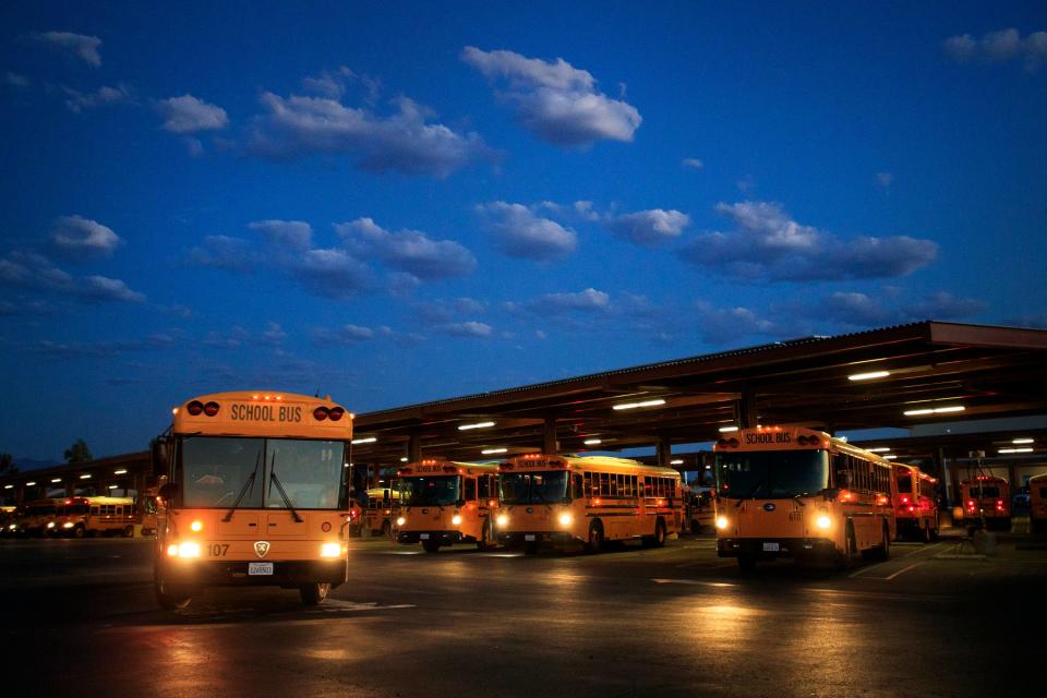 A school bus departs from the Coachella Valley School District before sunrise in Thermal, Calif., on August 31, 2022. 