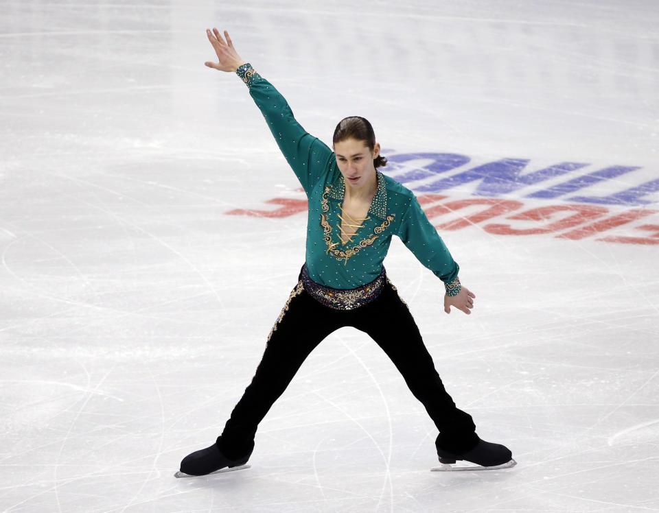 Jason Brown competes in the men's free skate at the U.S. Figure Skating Championships in Boston, Sunday, Jan. 12, 2014. (AP Photo/Elise Amendola)