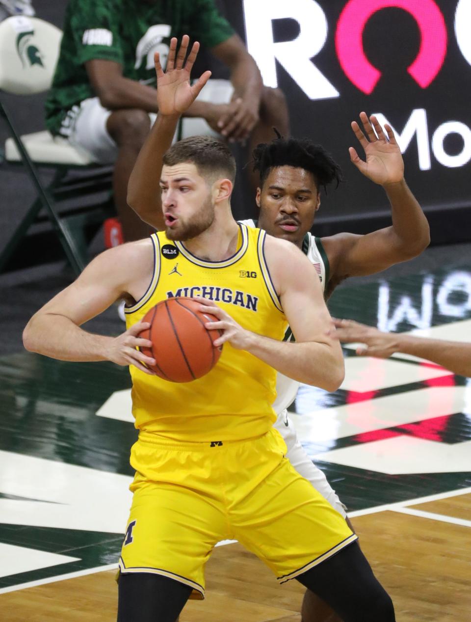 Michigan State Spartans forward Julius Marble II defends Michigan Wolverines center Hunter Dickinson on Sunday, March 7, 2021, at the Breslin Center in East Lansing.