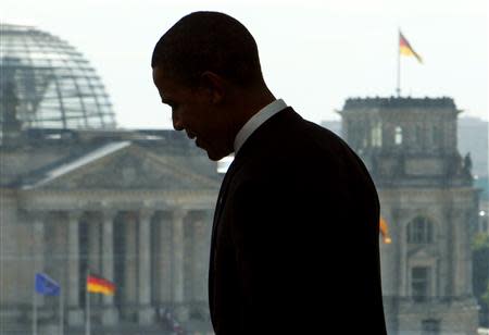 File photo of US Democratic presidential candidate Senator Barack Obama (D-IL) standing in front of a window with a view of the German Parliament building Reichstag during a meeting with German Chancellor Angela Merkel in Berlin July 24, 2008. Relations between Germany and the United States are worse now than during the U.S.-led invasion of Iraq a decade ago, a leading ally of Chancellor Angela Merkel said January 16, 2014, in a sign of mounting anger in Berlin over American spying tactics. REUTERS/Jim Young/Files