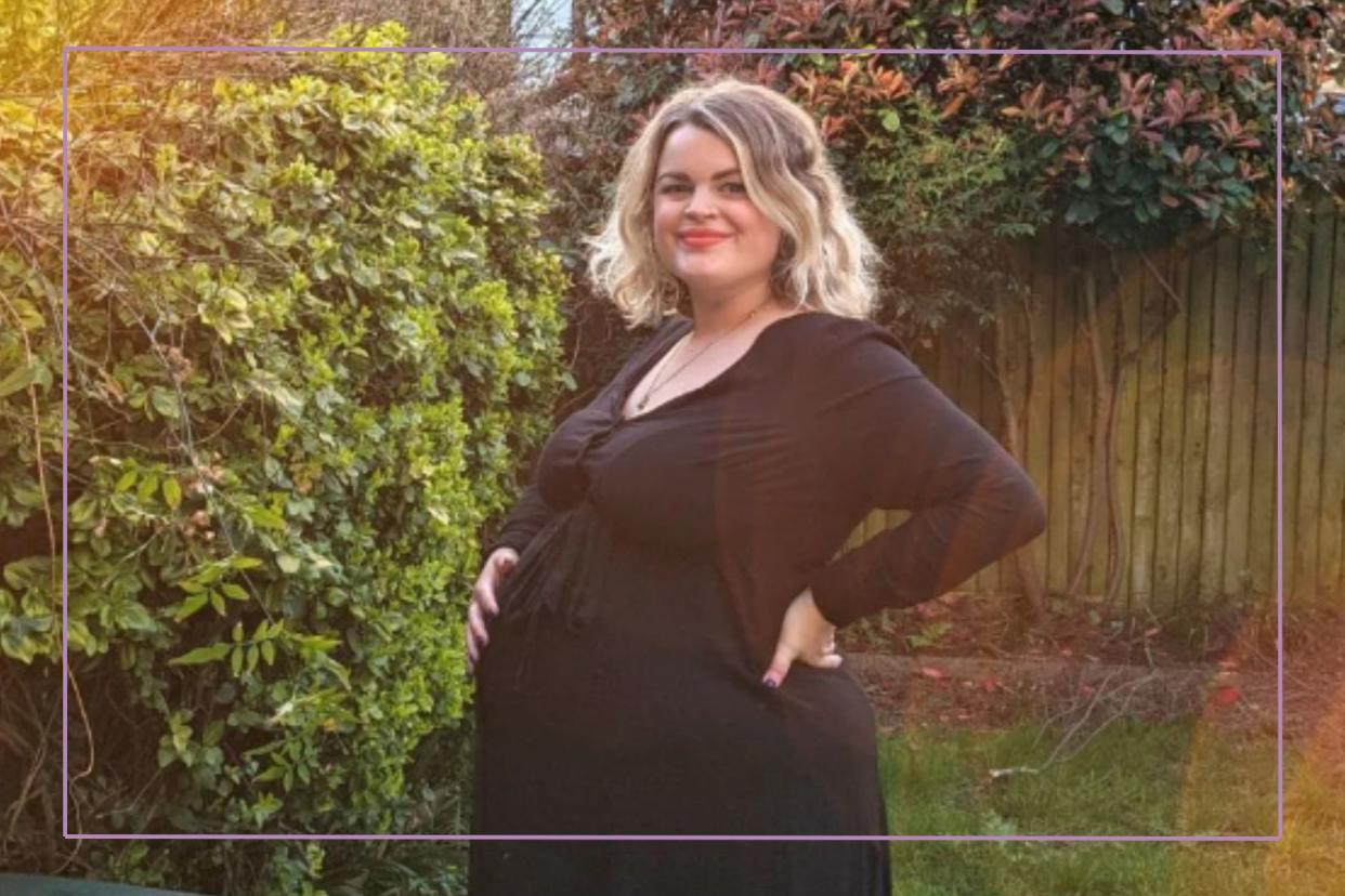  Plus size and pregnant woman in garden smiling at camera. 