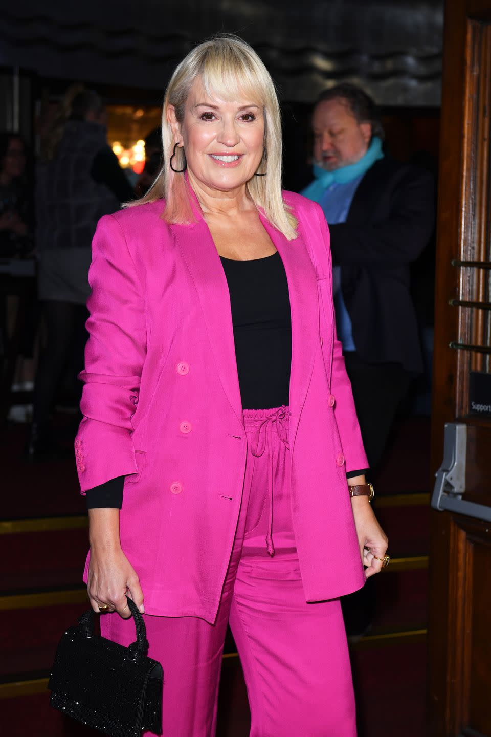 nicki chapman wearing a pink suit