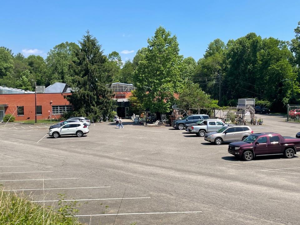 A building located at 115 Fairview Road on June 9, 2023, currently home to antique store Screen Door. The site is the proposed location for a 281-unit development in South Asheville.