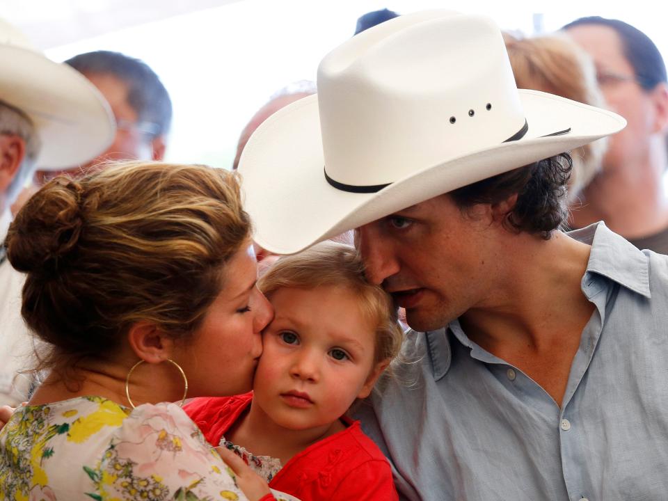 ustin Trudeau and his wife Sophie kiss their daughter Ella-Grace during the Liberal Stampede breakfast during the 100th anniversary of the Calgary Stampede in Calgary on July 7, 2012.