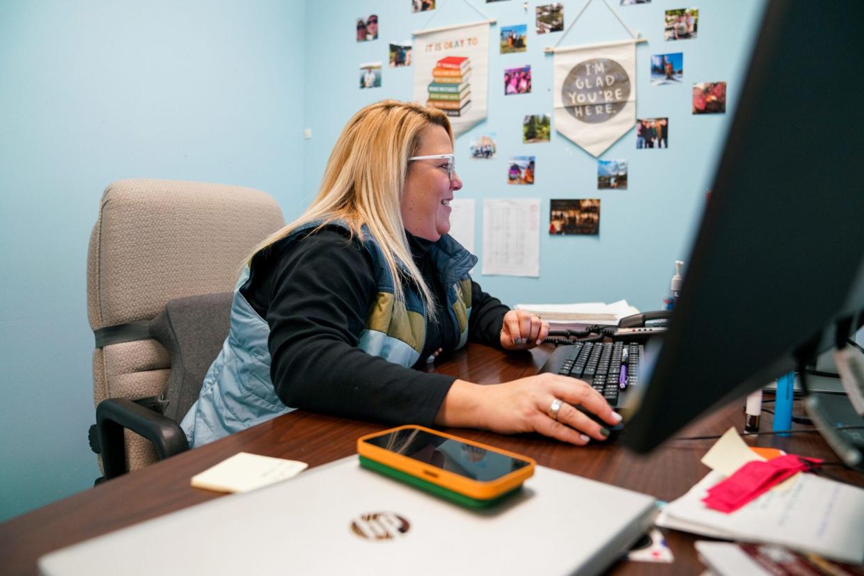 Attendance liaison for Sioux Falls Whittier Middle School Suzannah Reaves goes over attendance data, checking who is in and out of school.