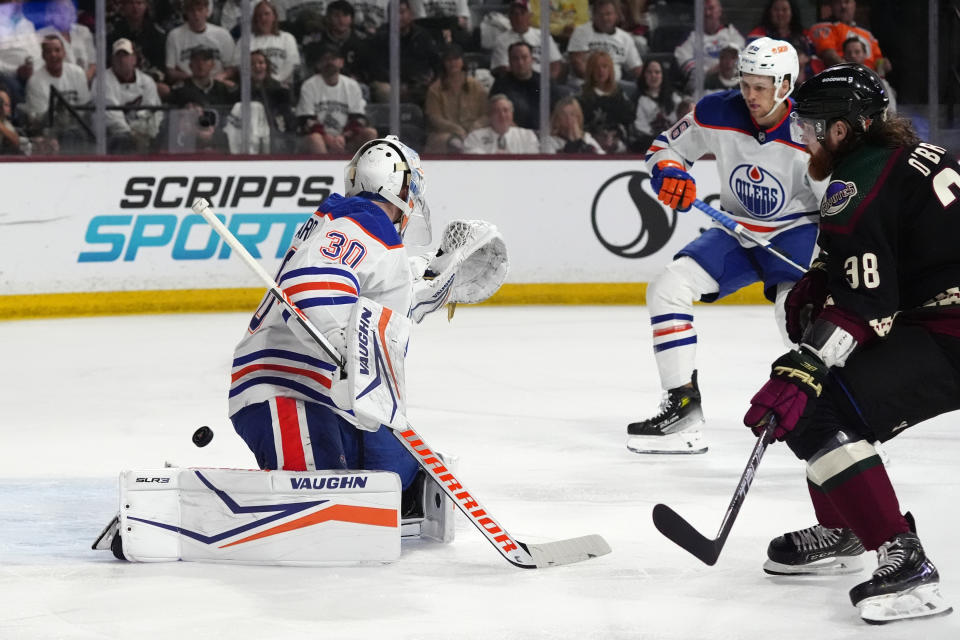 Arizona Coyotes center Liam O'Brien (38) scores a goal against Edmonton Oilers goaltender Calvin Pickard (30) as Oilers defenseman Philip Broberg, right rear, watches during the first period of an NHL hockey game Wednesday, April 17, 2024, in Tempe, Ariz. (AP Photo/Ross D. Franklin)