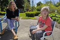 Holly Christensen, left, talks with her daughter, Lyra, Thursday, May 13, 2021, in Akron, Ohio. Anti-abortion activists say 2021 has been a breakthrough year for legislation in several states seeking to prohibit abortions based on a prenatal diagnosis of Down syndrome. Opponents of the bills, including some parents with children who have Down syndrome like Holly, argue that elected officials should not be meddling with a woman’s deeply personal decision on whether to carry a pregnancy to term after a Down syndrome diagnosis. (AP Photo/Tony Dejak)