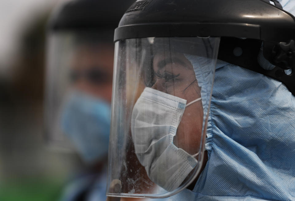 Members of cleaning crew wearing protective masks and suits disinfect a bus as a preventive measure against the spread of the new coronavirus, in Mexico City, Thursday, April 2, 2020. Mexico has started taking tougher measures against the new coronavirus, but some experts warn the country is acting too late and testing too little to prevent the type of crisis unfolding across the border in the United States. (AP Photo/Marco Ugarte)