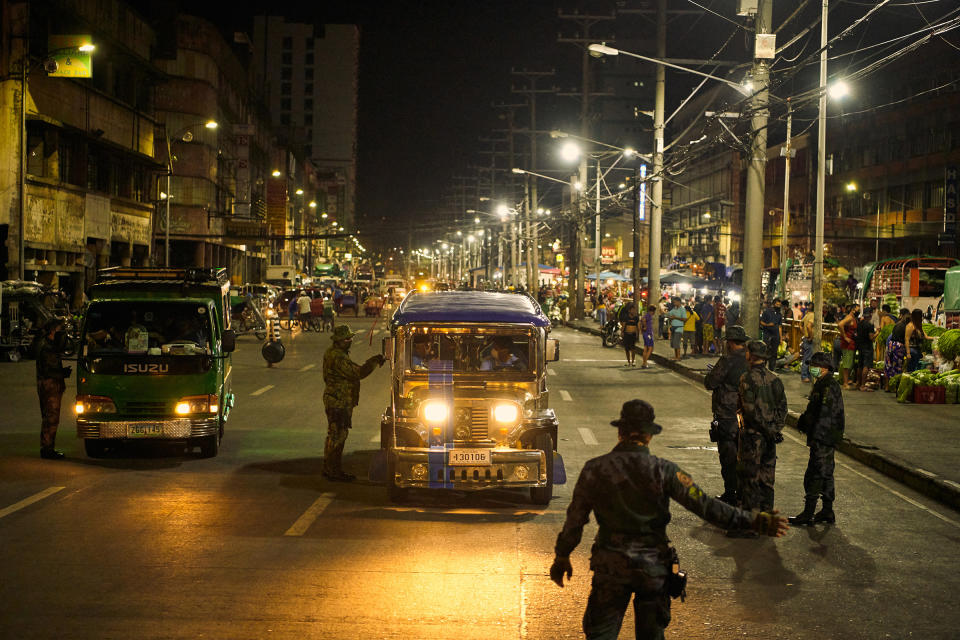 Police check vehicles in Manila during the coronavirus pandemic on March 18, 2020.<span class="copyright">Jes Aznar—The New York Times/Redux</span>