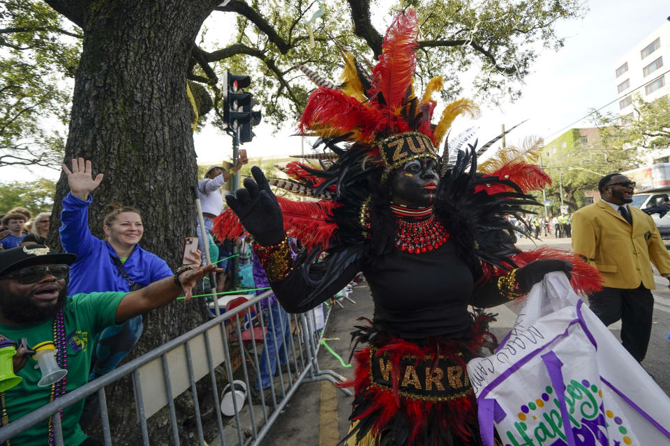 A member of the traditional Mardi Gras group The Tramps marches during the Krewe of Zulu Parade on Mardi Gras Day in New Orleans, Tuesday, Feb. 21, 2023. (AP Photo/Gerald Herbert)