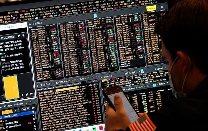 A trader works on the floor of the New York Stock Exchange at the closing bell January 14, 2022, in New York, New York. (Photo by TIMOTHY A. CLARY / AFP) (Photo by TIMOTHY A. CLARY/AFP via Getty Images)