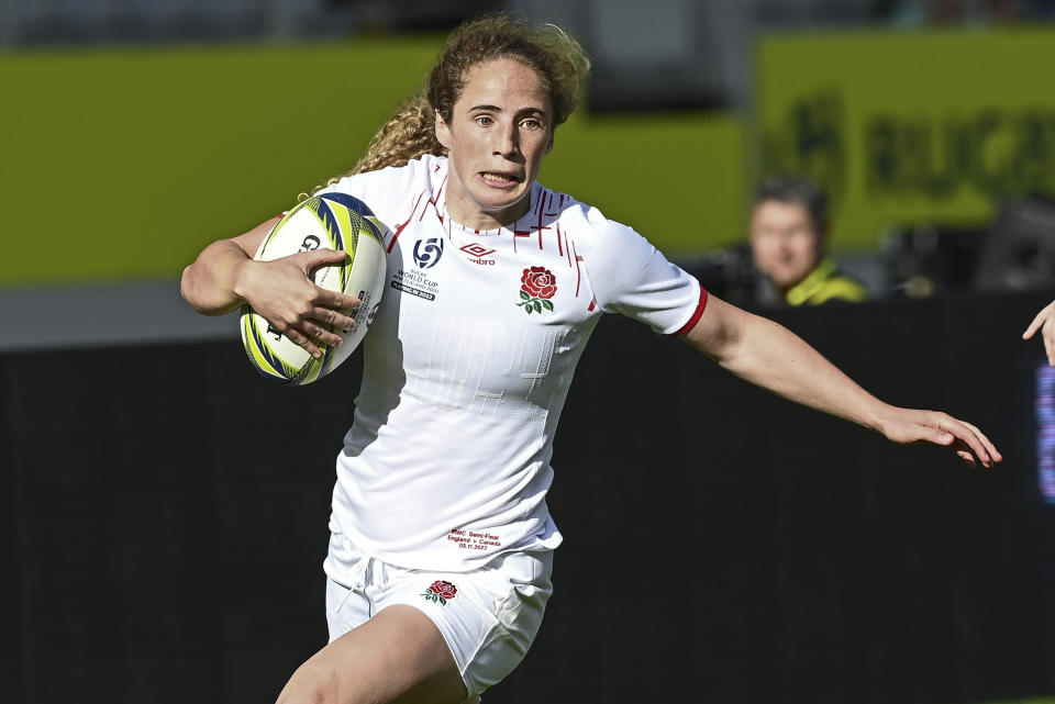 Abby Dow of England runs in for a try during the women's rugby World Cup semifinal between Canada and England at Eden Park in Auckland, New Zealand, Saturday, Nov.5, 2022. (Andrew Cornaga/Photosport via AP)