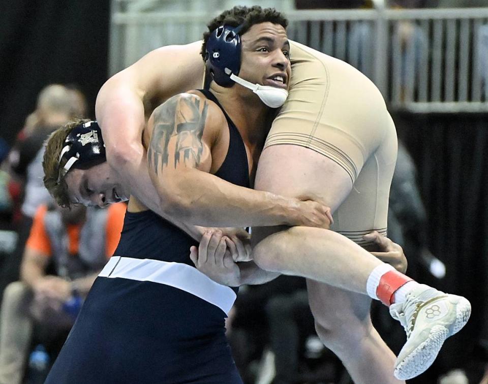 Penn State’s Greg Kerkvliet looks to takedown Navy’s Grady Griess in their 285 pound second round match of the NCAA Championships on Thursday, March 21, 2024 at TMobile Center in Kansas City, Mo. Kerkvliet collected a 9-1 win.