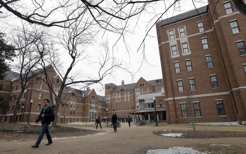 In this Feb. 24, 2015 photo, students walk through the Warren College and Moore College area at Vanderbilt University on Tuesday, Feb. 24, 2015, in Nashville, Tenn. Vanderbilt is one of a small but growing number of U.S. colleges and universities that have embraced a "residential college" model where students become part of a close-knit but diverse community that enhances both their academic and social lives. (AP Photo/Mark Humphrey)