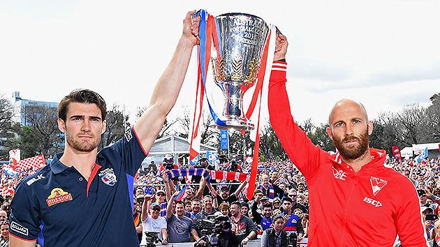 Easton Wood of the Bulldogs and Jarrad McVeigh of the Swans pose with the Premiership trophy. Pic: Getty