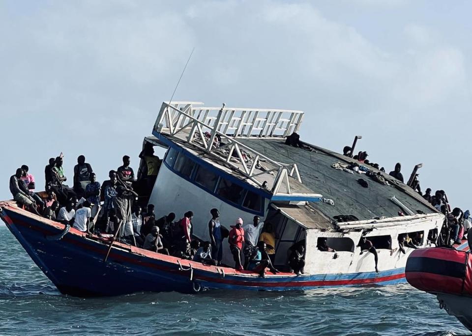 Haitian migrants are gathered on a wooden vessel that grounded off Ocean Reef Club in Key Largo Sunday, March 6, 2022.