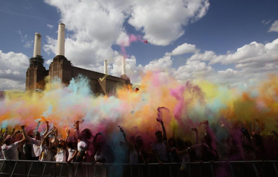 Battersea: People throwing brightly coloured powder in the air during the Holi One Festival, at Battersea Power Station in London. (PA)