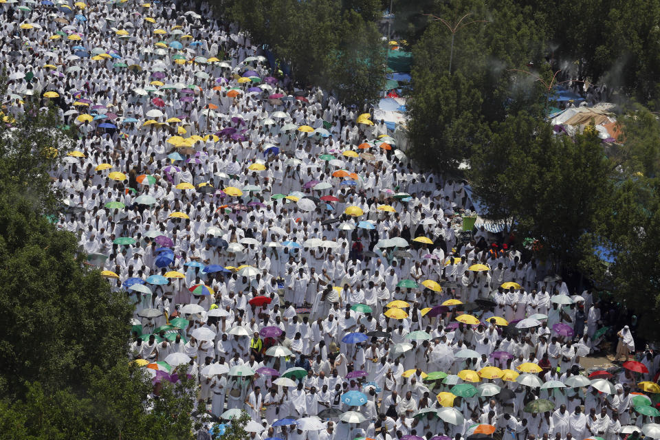 Hundreds of thousands of Muslim pilgrims pray outside Namira Mosque in Arafat during the annual hajj pilgrimage, near the holy city of Mecca, Saudi Arabia, Saturday, Aug. 10, 2019. More than 2 million pilgrims were gathered to perform initial rites of the hajj, an Islamic pilgrimage that takes the faithful along a path traversed by the Prophet Muhammad some 1,400 years ago. (AP Photo/Amr Nabil)