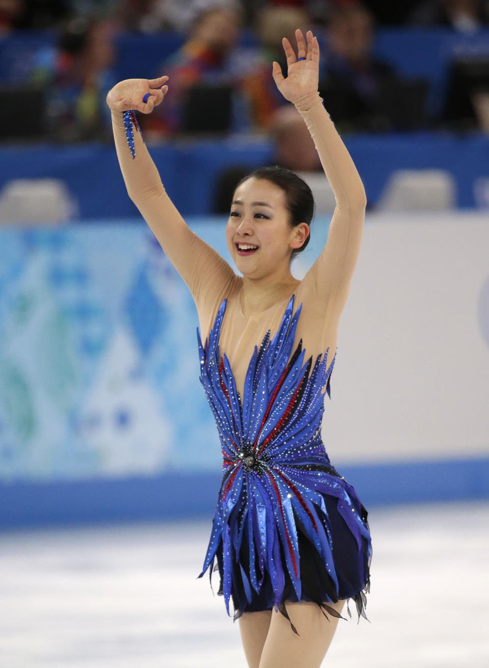 Mao Asada of Japan acknowledges the crowd after completing her routine in the women's free skate figure skating finals at the Iceberg Skating Palace during the 2014 Winter Olympics, Thursday, Feb. 20, 2014, in Sochi, Russia. (AP Photo/Bernat Armangue)