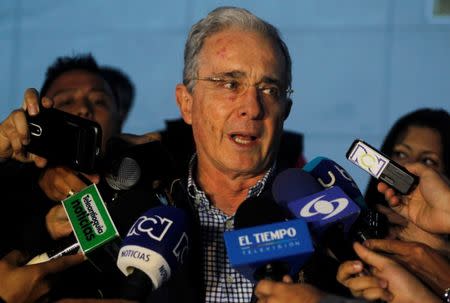 Colombian former president and Senator Alvaro Uribe talks to the media after a meeting with Colombia's President Juan Manuel Santos over a new peace deal with Revolutionary Armed Forces of Colombia (FARC), at military air base in Rionegro, Colombia November 12, 2016. REUTERS/Fredy Builes