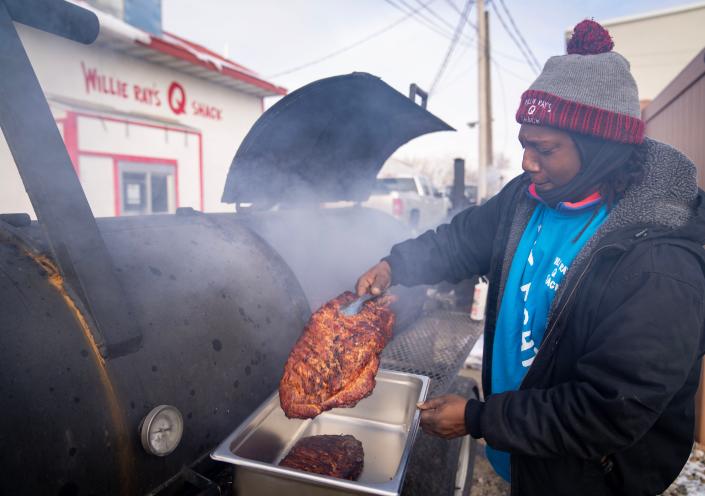 Willie Ray Fairley, the owner of Willie RayÕs ÒQÓ Shack, works the grills outside his store in Cedar Rapids, Thursday, Nov. 17, 2022.
