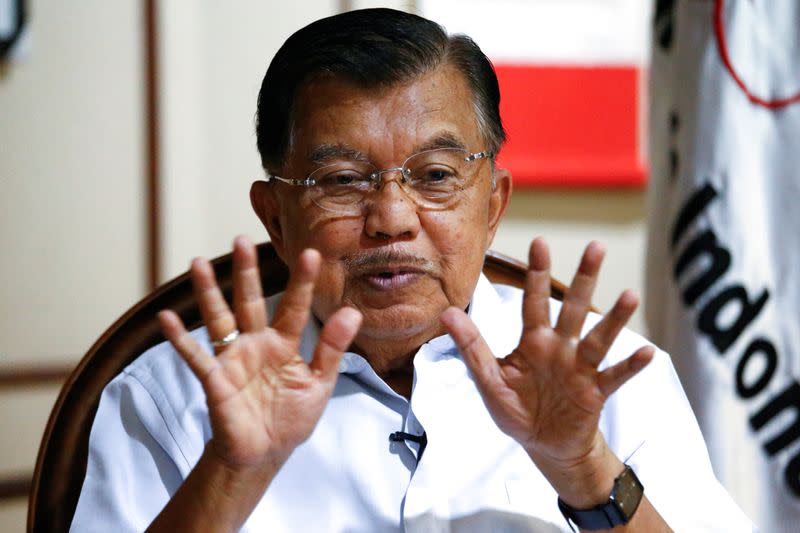 FILE PHOTO: Chairman of Indonesia's Red Cross and former Vice President Jusuf Kalla gestures as he talks during an interview at his office in Jakarta