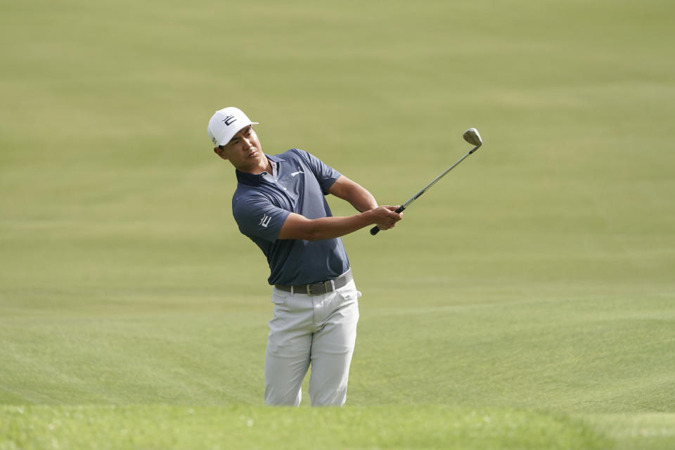 Justin Suh of the United States hits a shot on the fourth hole in the final round of the PGA Tour Zozo Championship at the Narashino Country Club in Inzai on the outskirts of Tokyo, Sunday, Oct. 22, 2023. (AP Photo/Tomohiro Ohsumi)